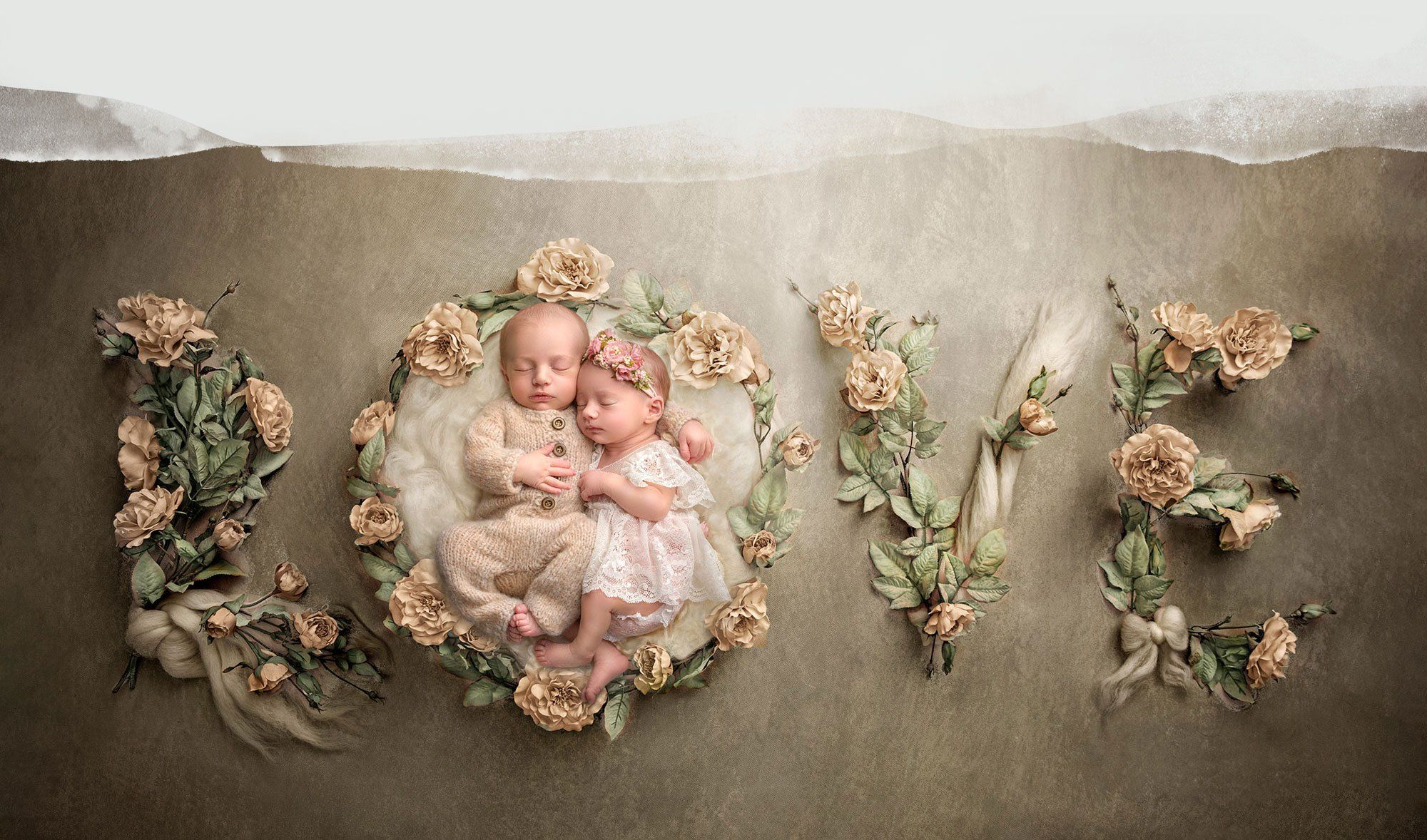 CT Newborn Photographer twin newborn babies sleeping in the middle of a floral word Love