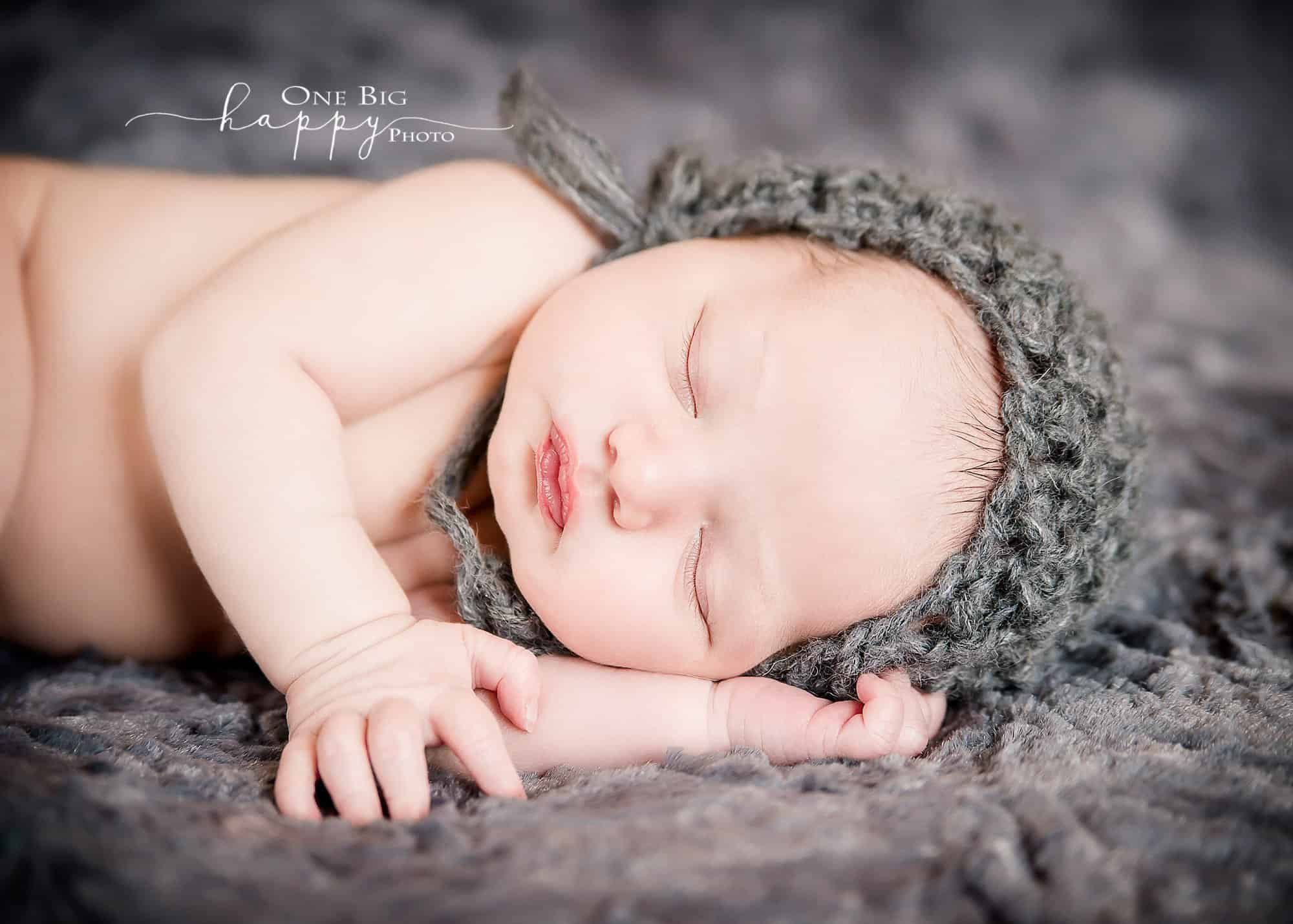 Newborn baby boy sleeping in grey knit cap on grey blanket Glastonbury CT Newborn Photographer One Big Happy Photo www.onebighappyphoto.com/newborns Newborn baby boy sleeping in grey knit cap on grey blanket Glastonbury CT Newborn Photographer One Big Happy Photo www.onebighappyphoto.com/newborns