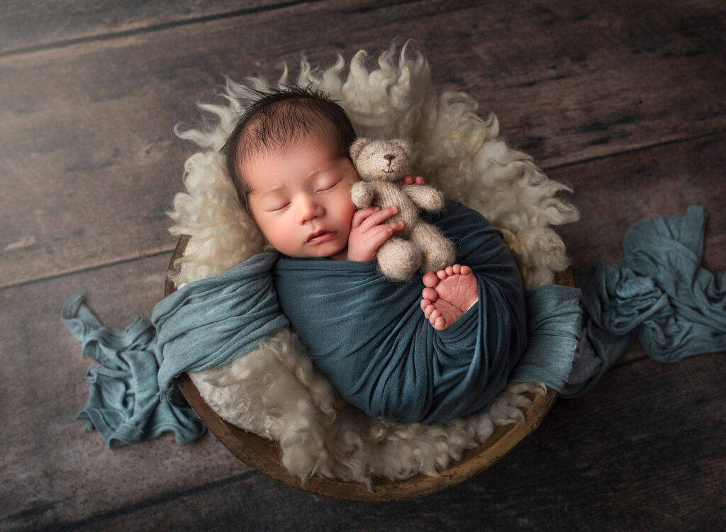 best time for newborn photography newborn sleeping with his teddy bear