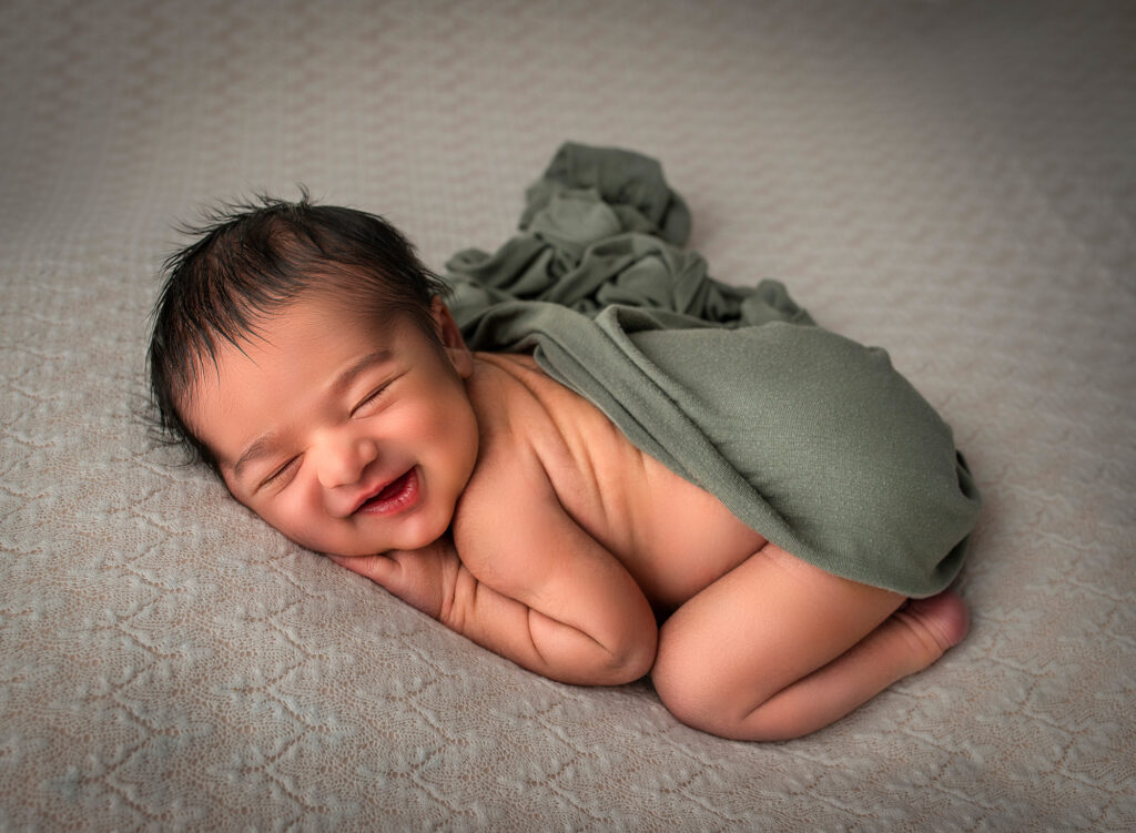 best time to do newborn photos big smile on newborn baby