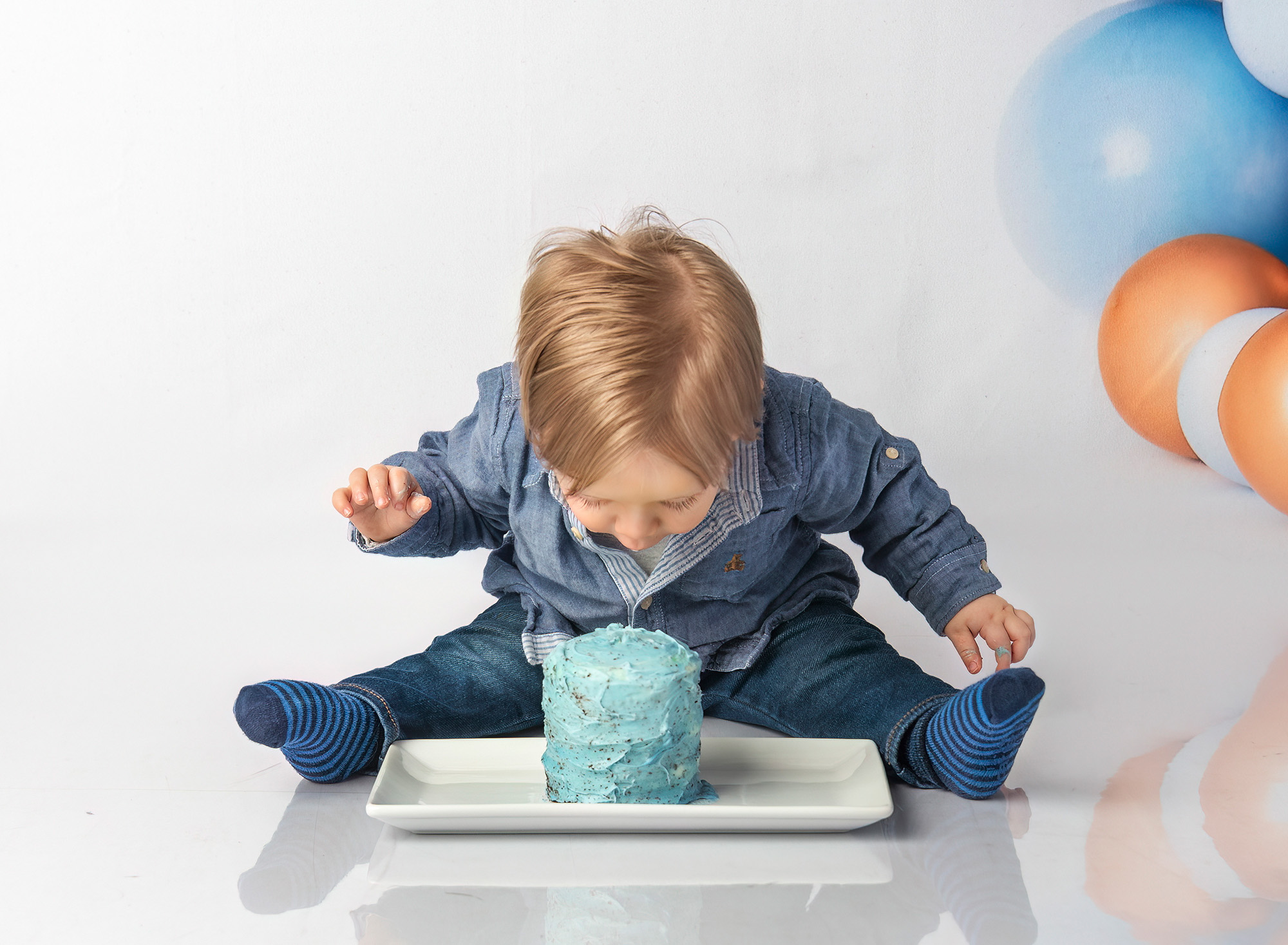 Bryce mesmerized with his blue frosted birthday cake