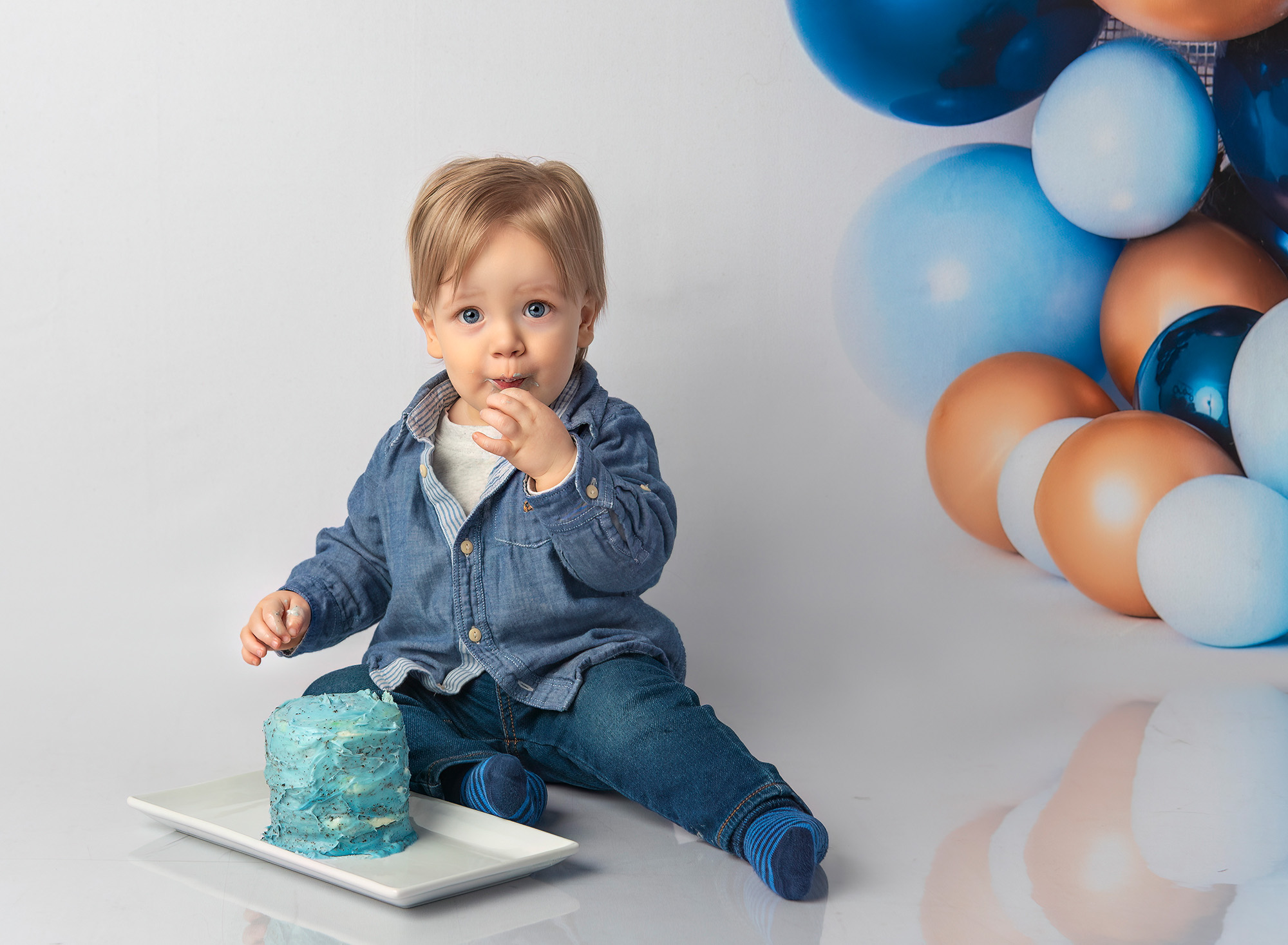 Bryce trying his first birthday cake