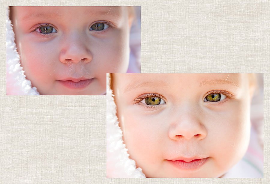 baby girl's face with green eyes cuddling a white blanket