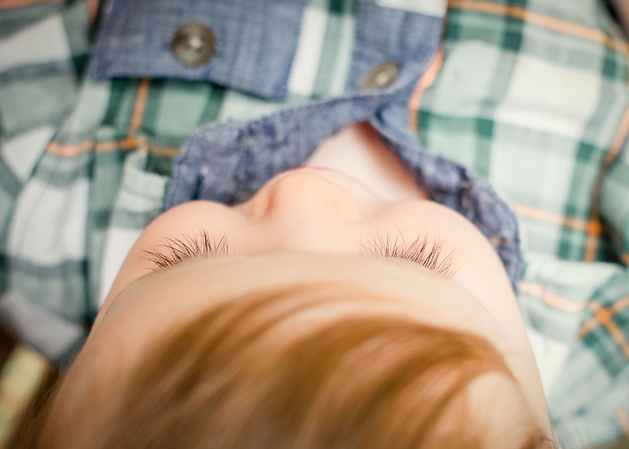 9 mo old baby boy with red hair looking down on his eyelashes One Big Happy Photo
