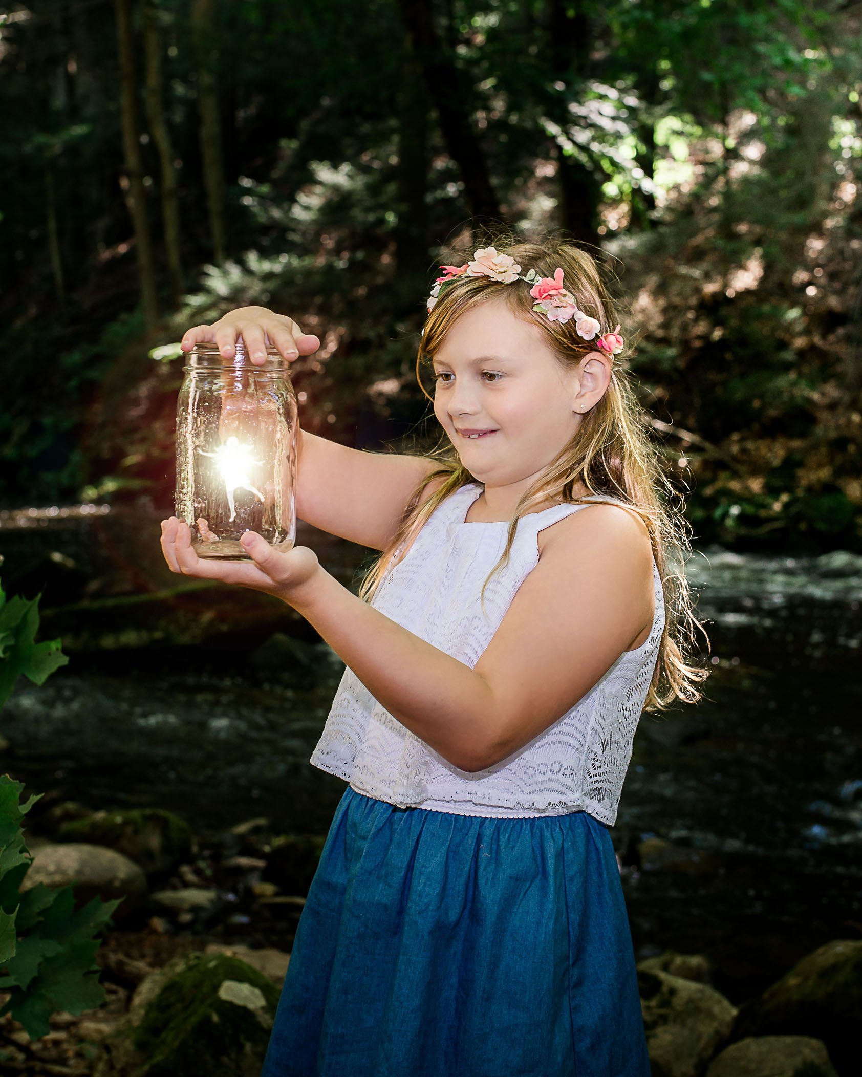little girl with floral crown captures fairy in jar One Big Happy Photo