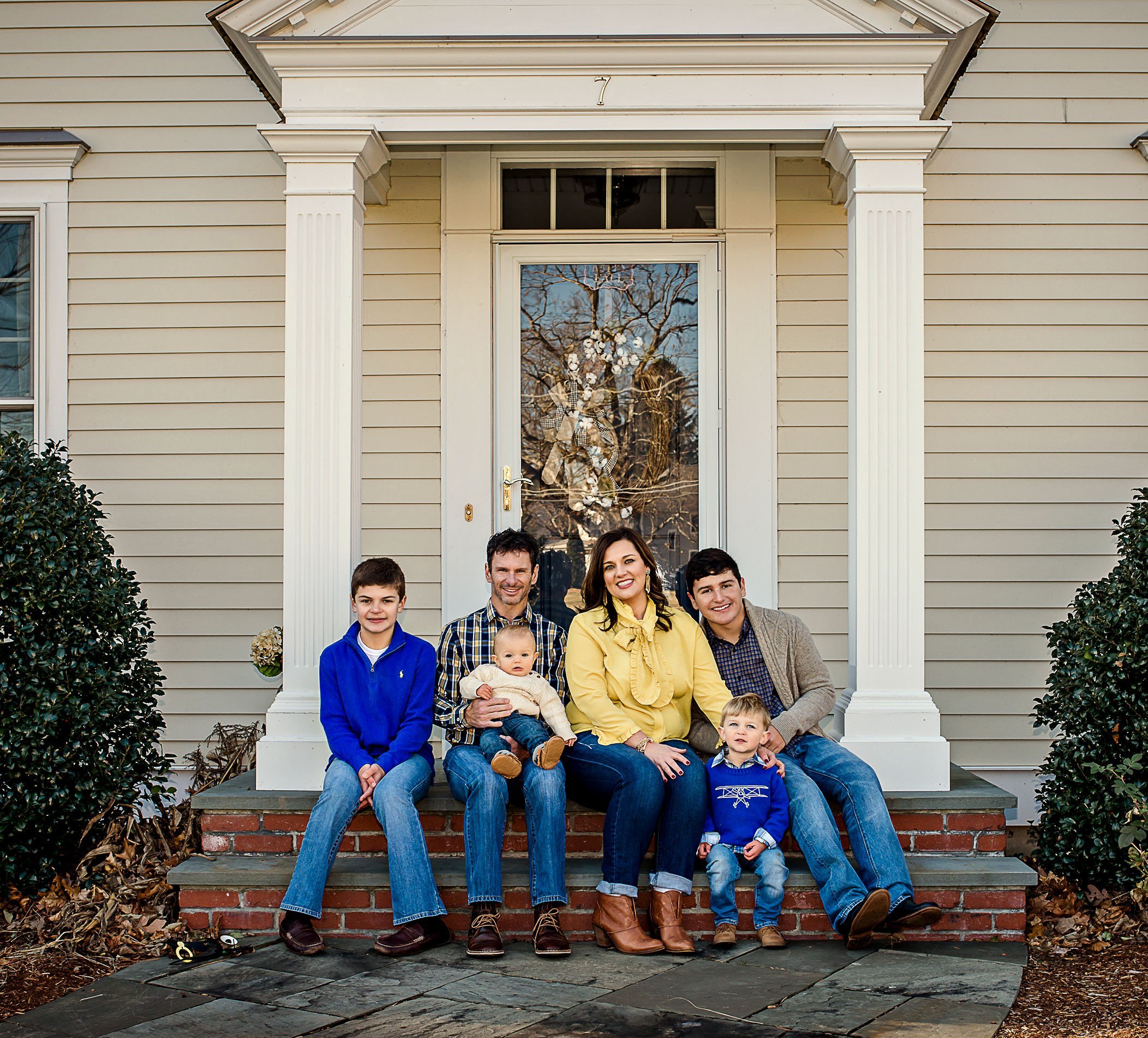 kids from 2 marriages in family on front porch One Big Happy Photo
