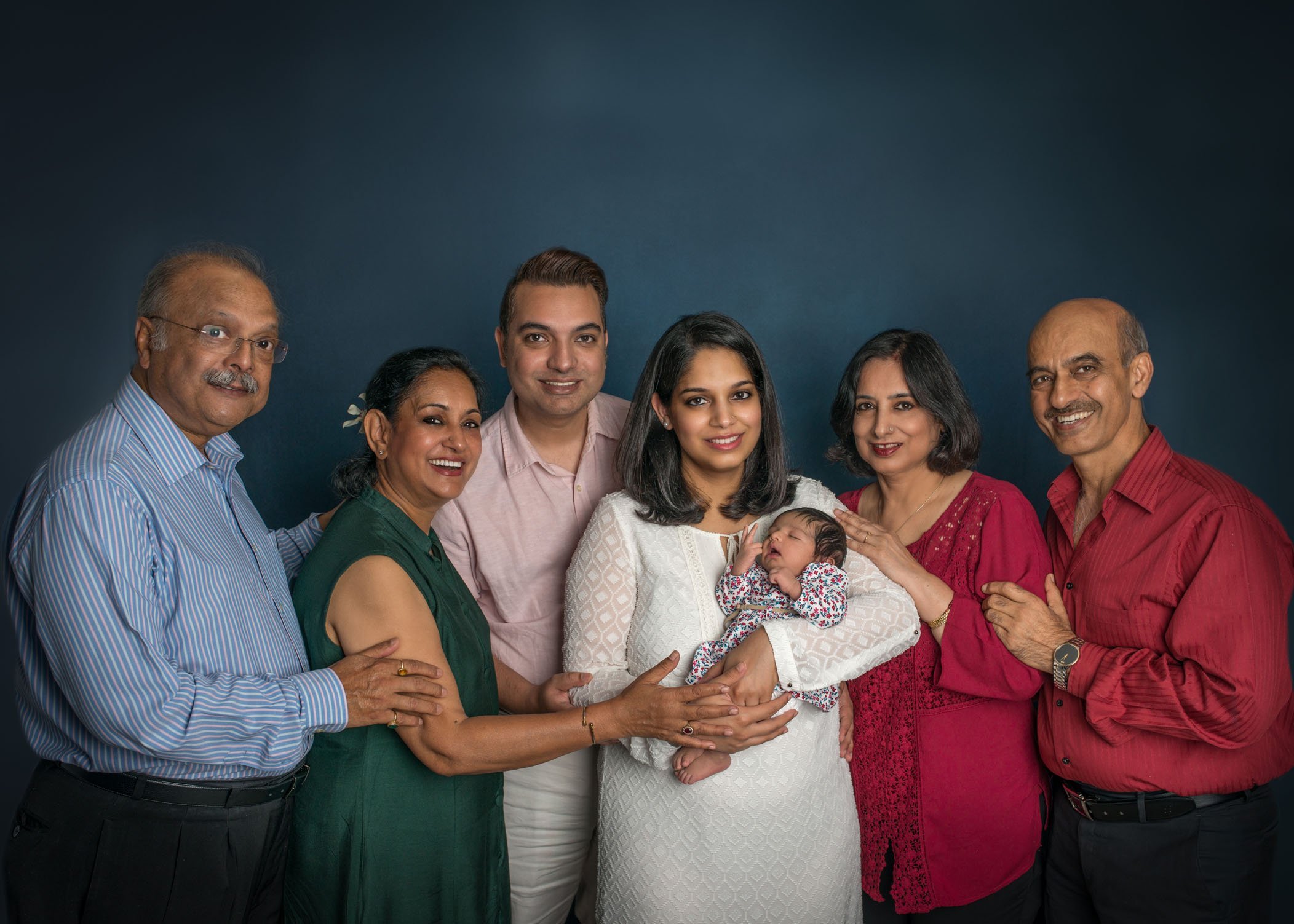 All grandparents, parents and newborn baby