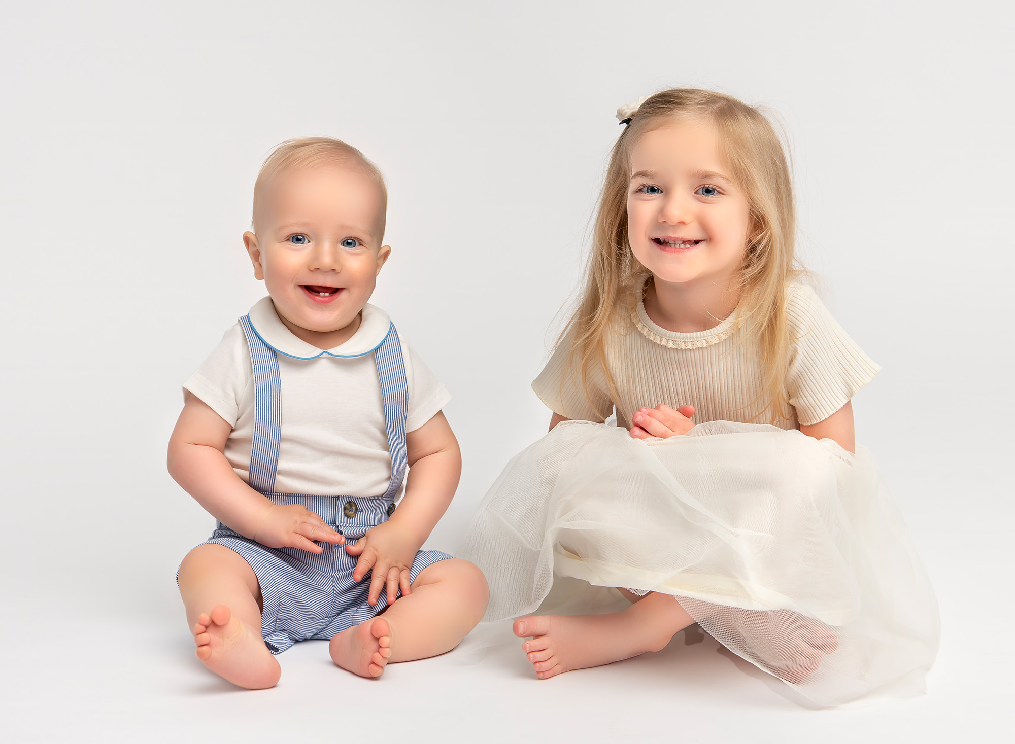 All White Smash Photoshoot Julian and Emilia smiling together in an all white themed photoshoot.