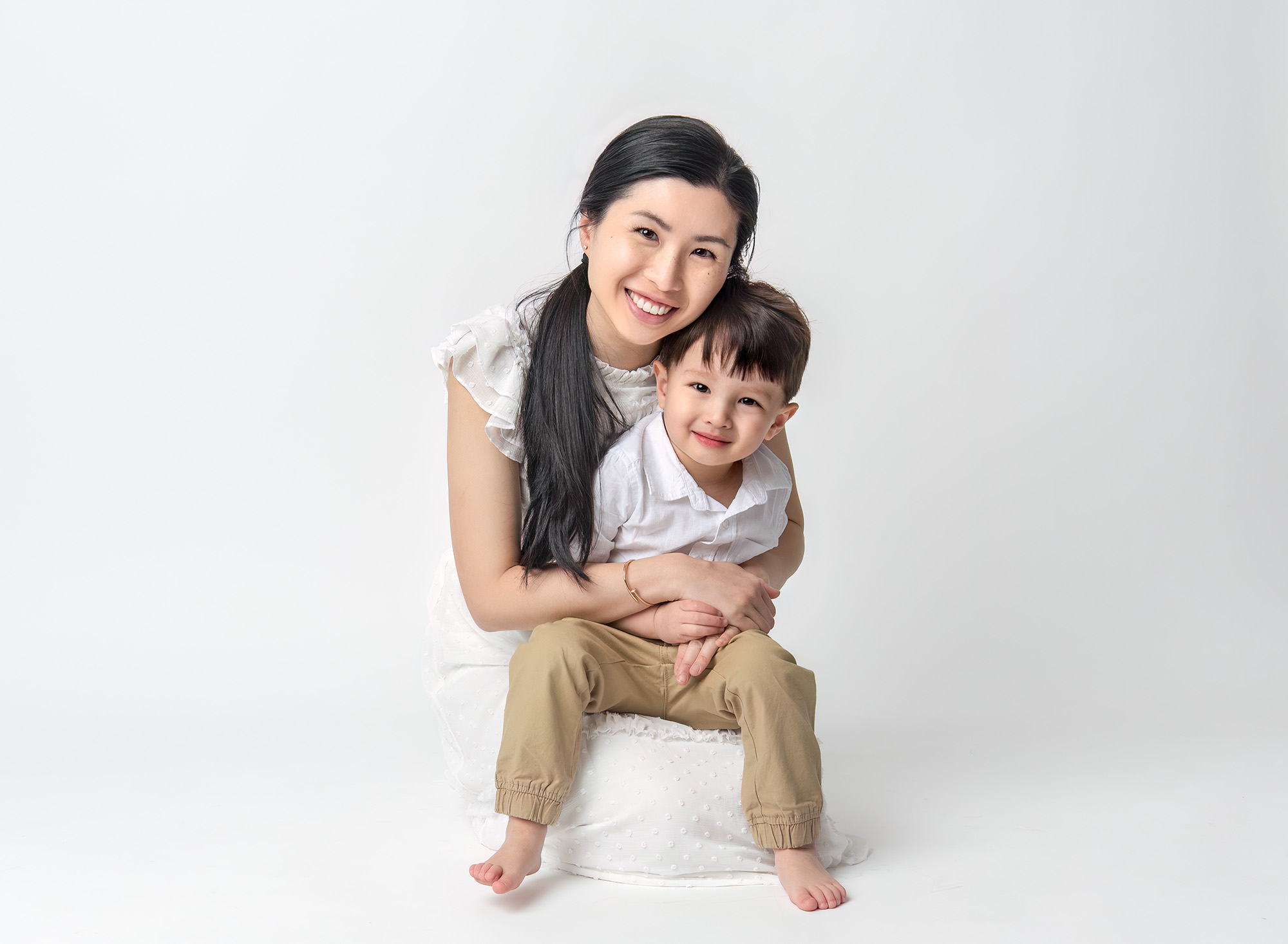 Mom sitting down, holding Joshua in a sweet embrace