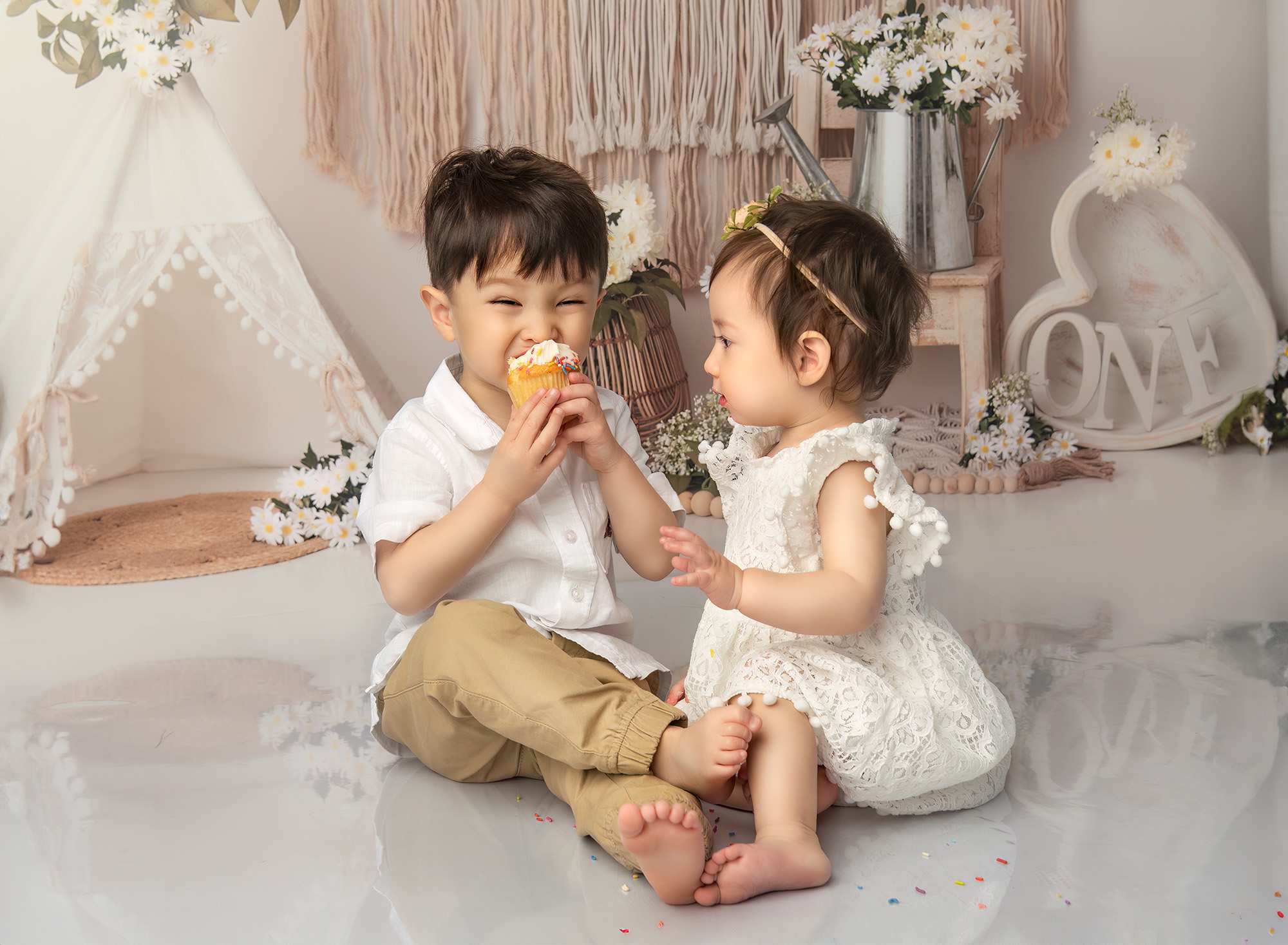 Joshua playfully eating the cupcake