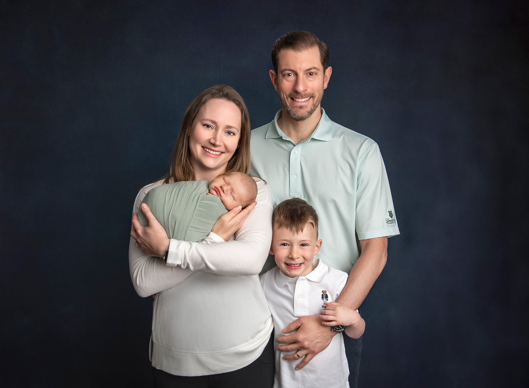 Family photography with Newborn Family portrait of mom, dad, big brother Evan, and baby Owen