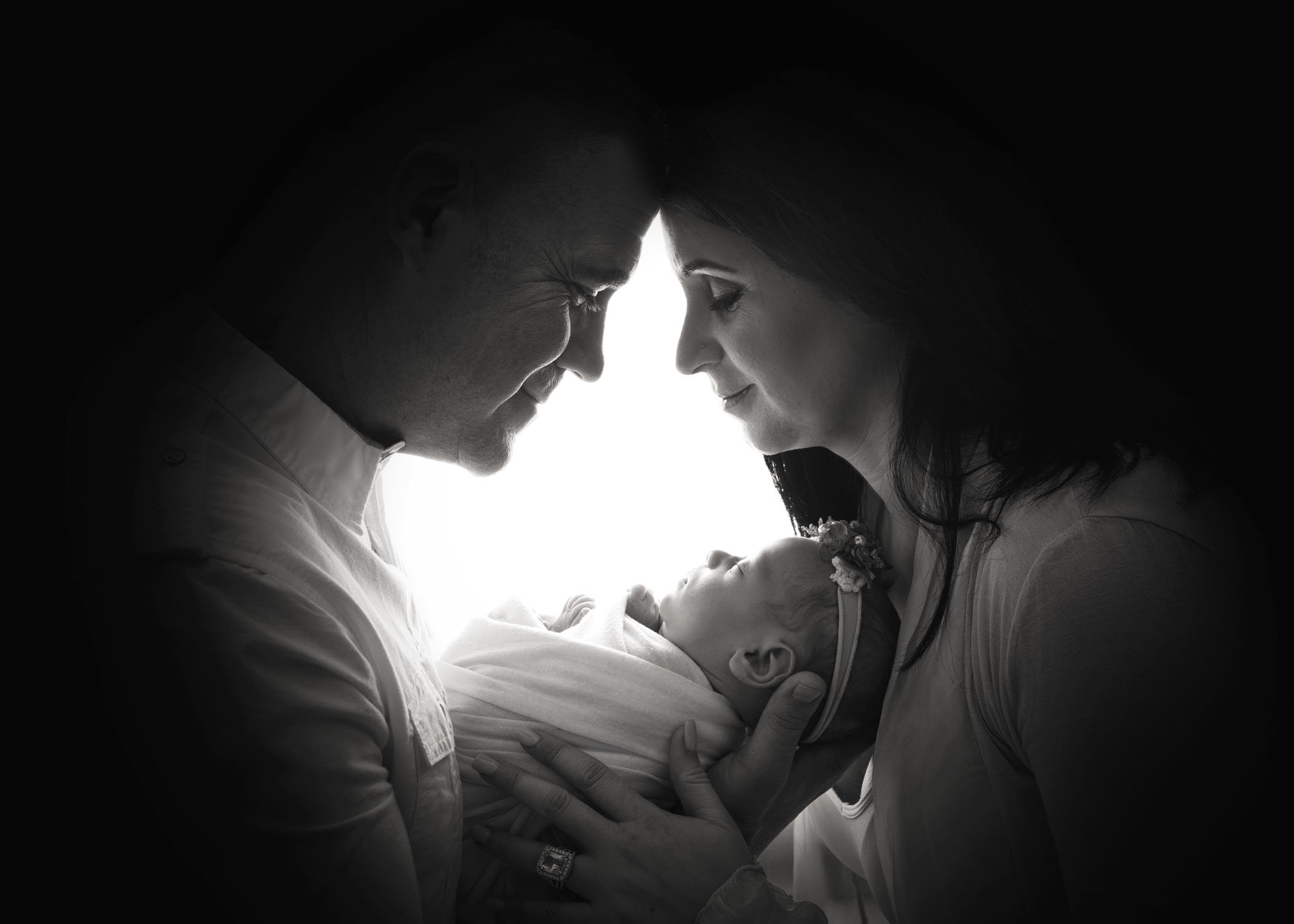Mom Dad and newborn baby triangle in black and white