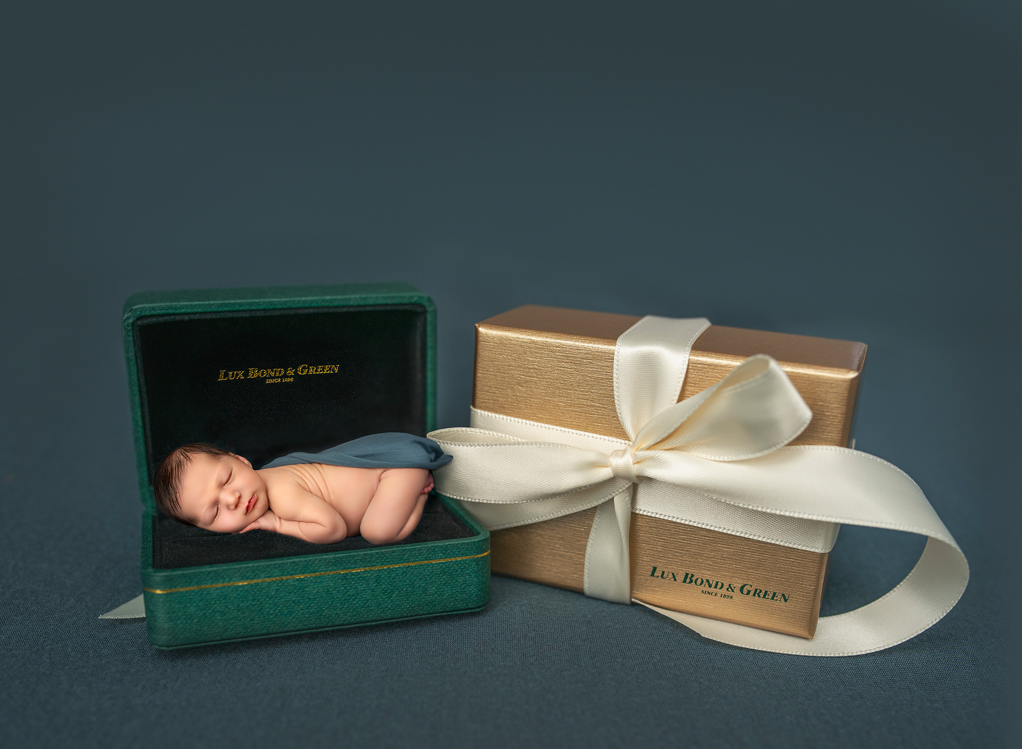 Newborn Family Photography Newborn boy asleep in a jewelry case