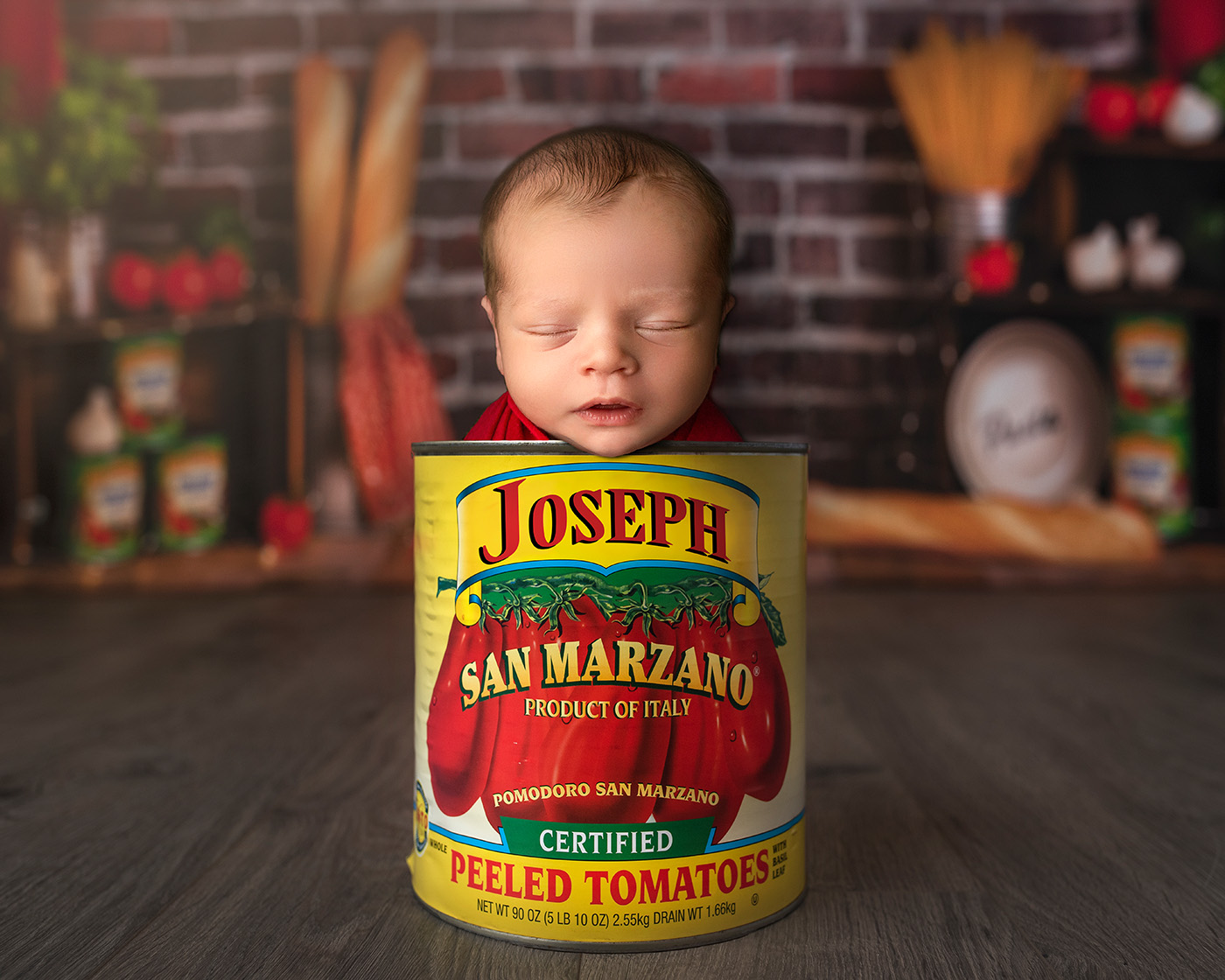 Newborn Photography Shoot Baby Joseph sleeps peacefully in a can of tomatoes in front of a trattoria, capturing the essence of his Italian heritage.