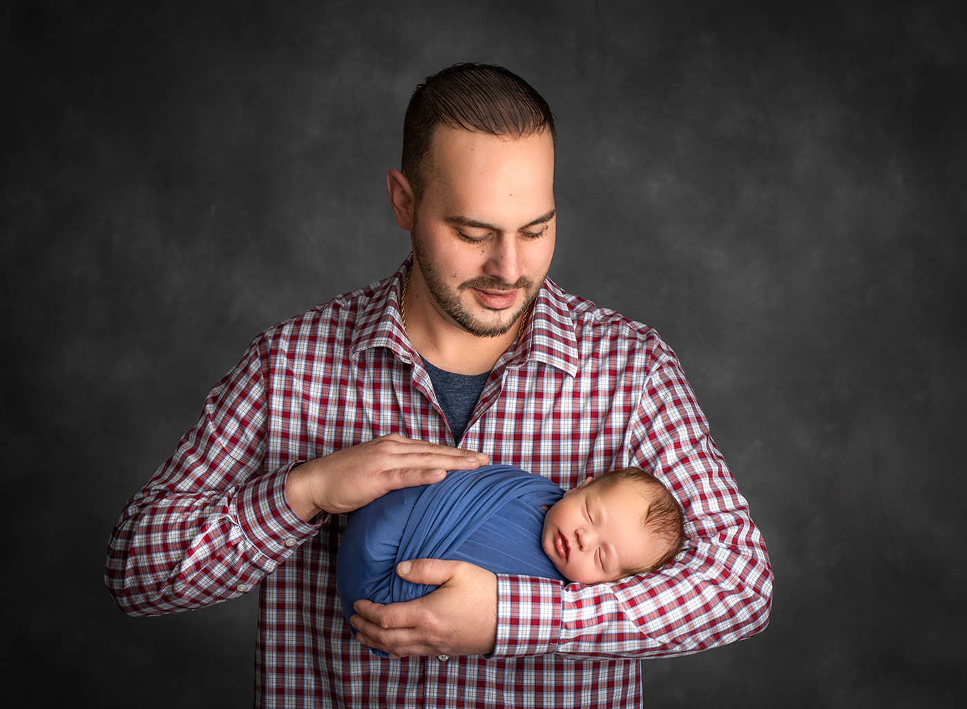 the pride gleaming in Dad's eyes as he held his little one close