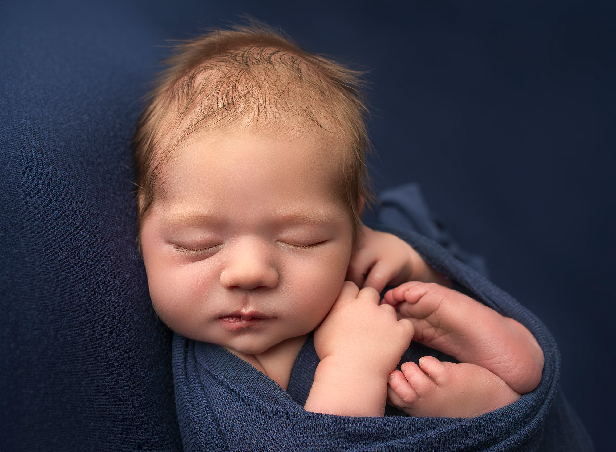 Best time for newborn photos little boy sleeping curled up