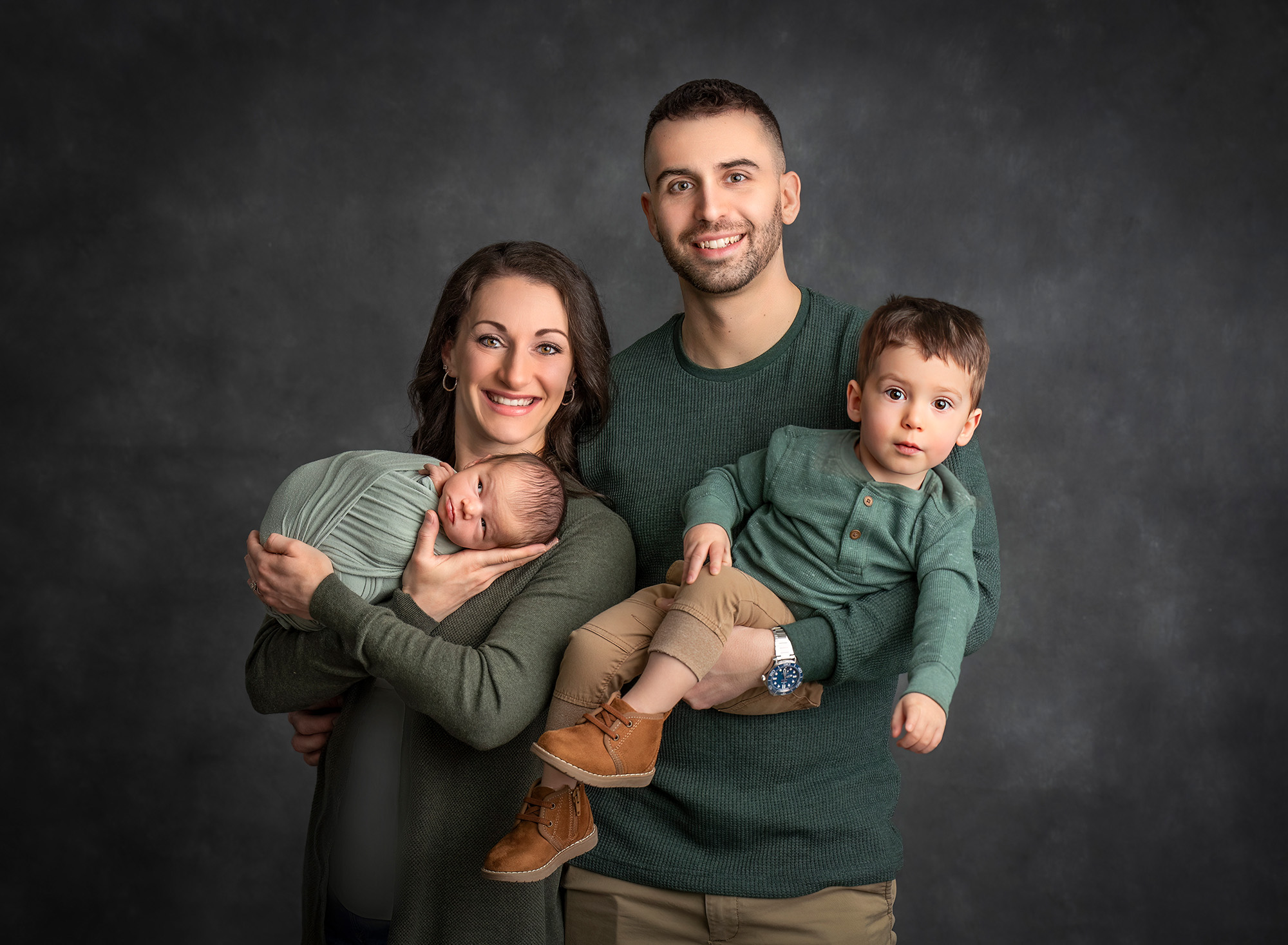 Newborn brother family of four in their first family portrait