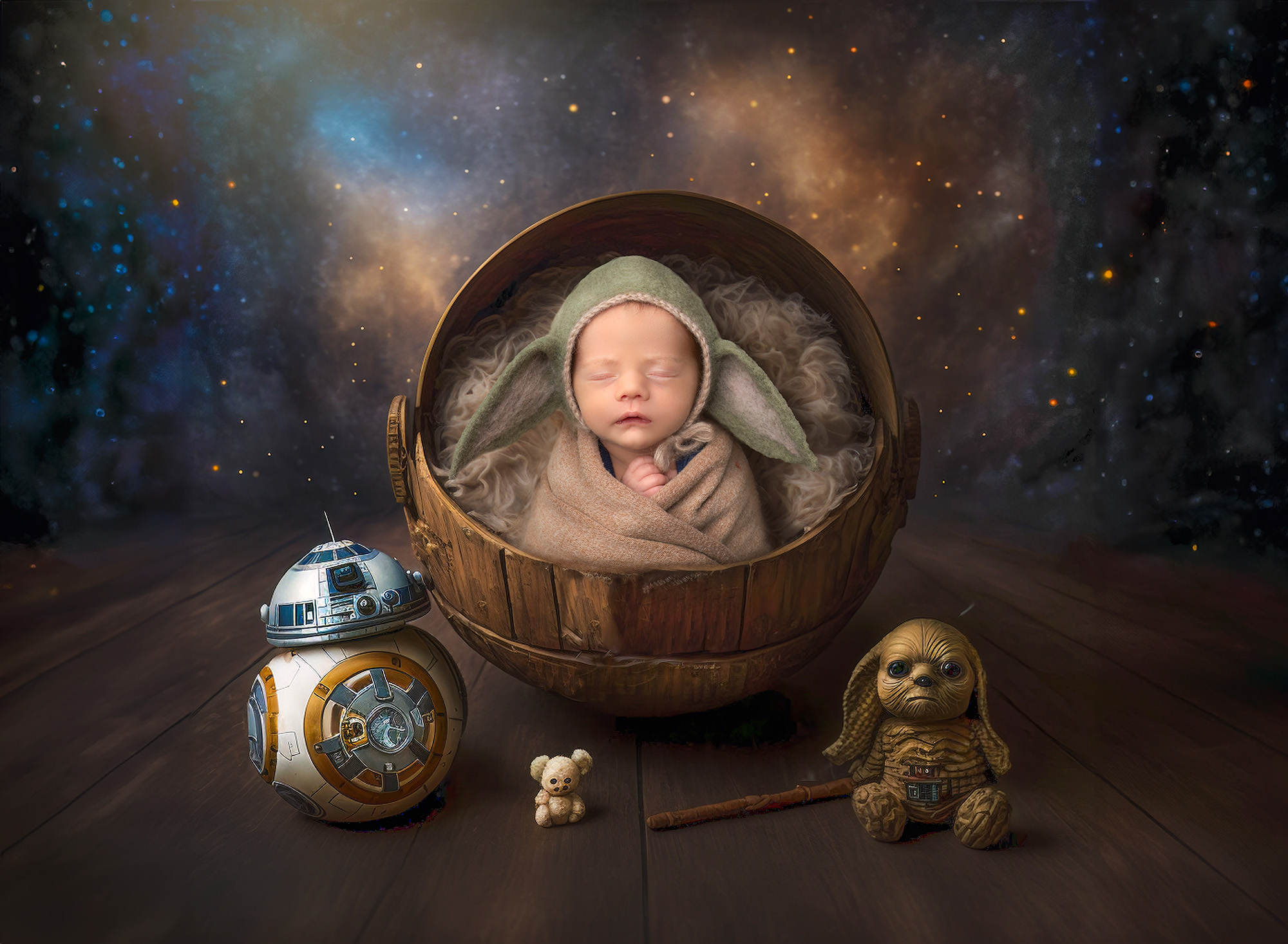 newborn baby boy sitting in a star wars backdrop wearing a Baby Yoda bonnet