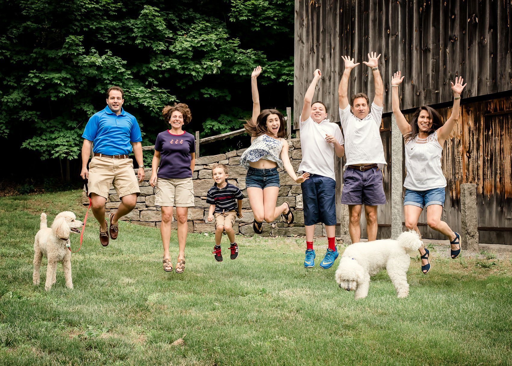 two families jumping in the air