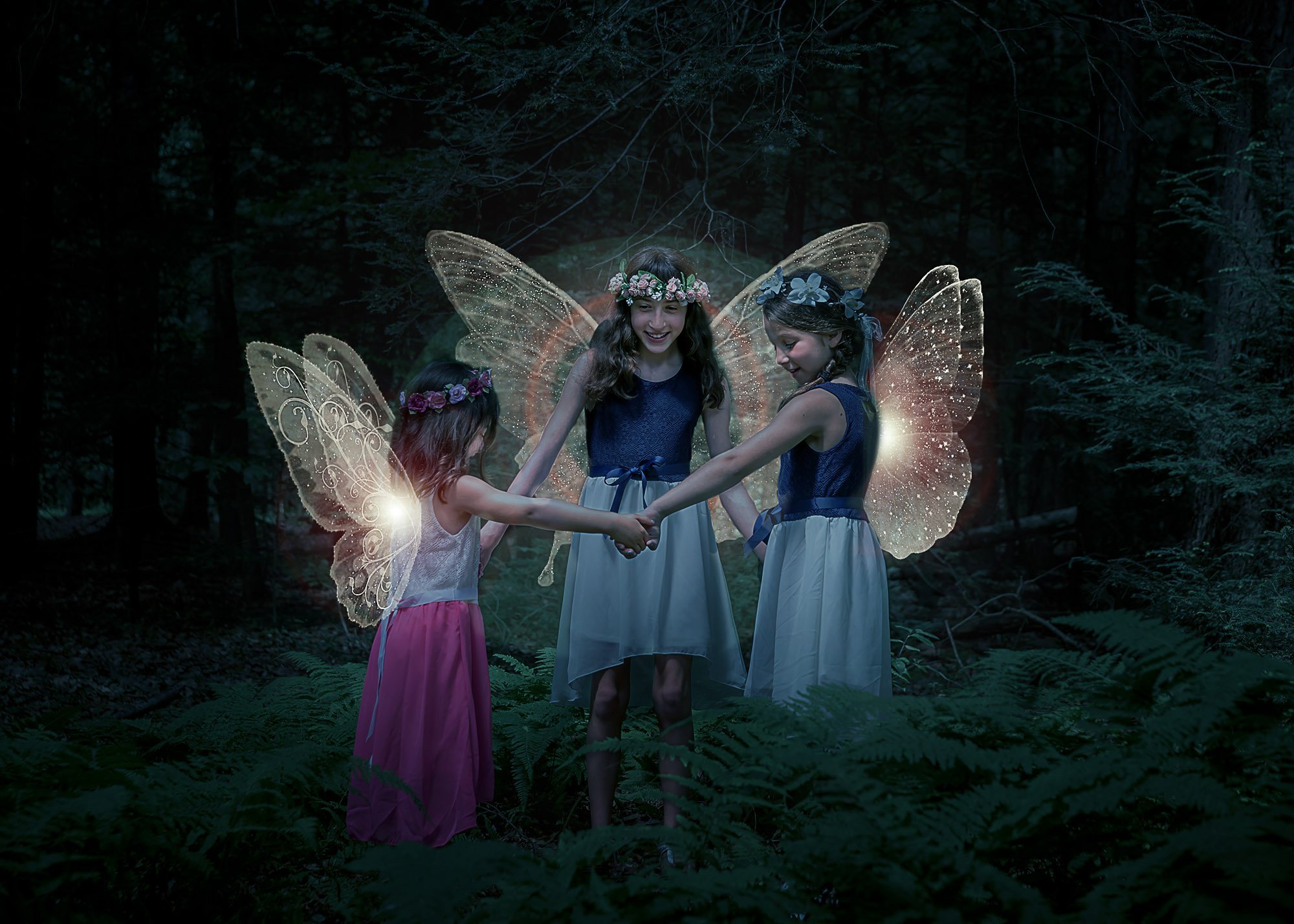Three fairies dancing in a circle at night