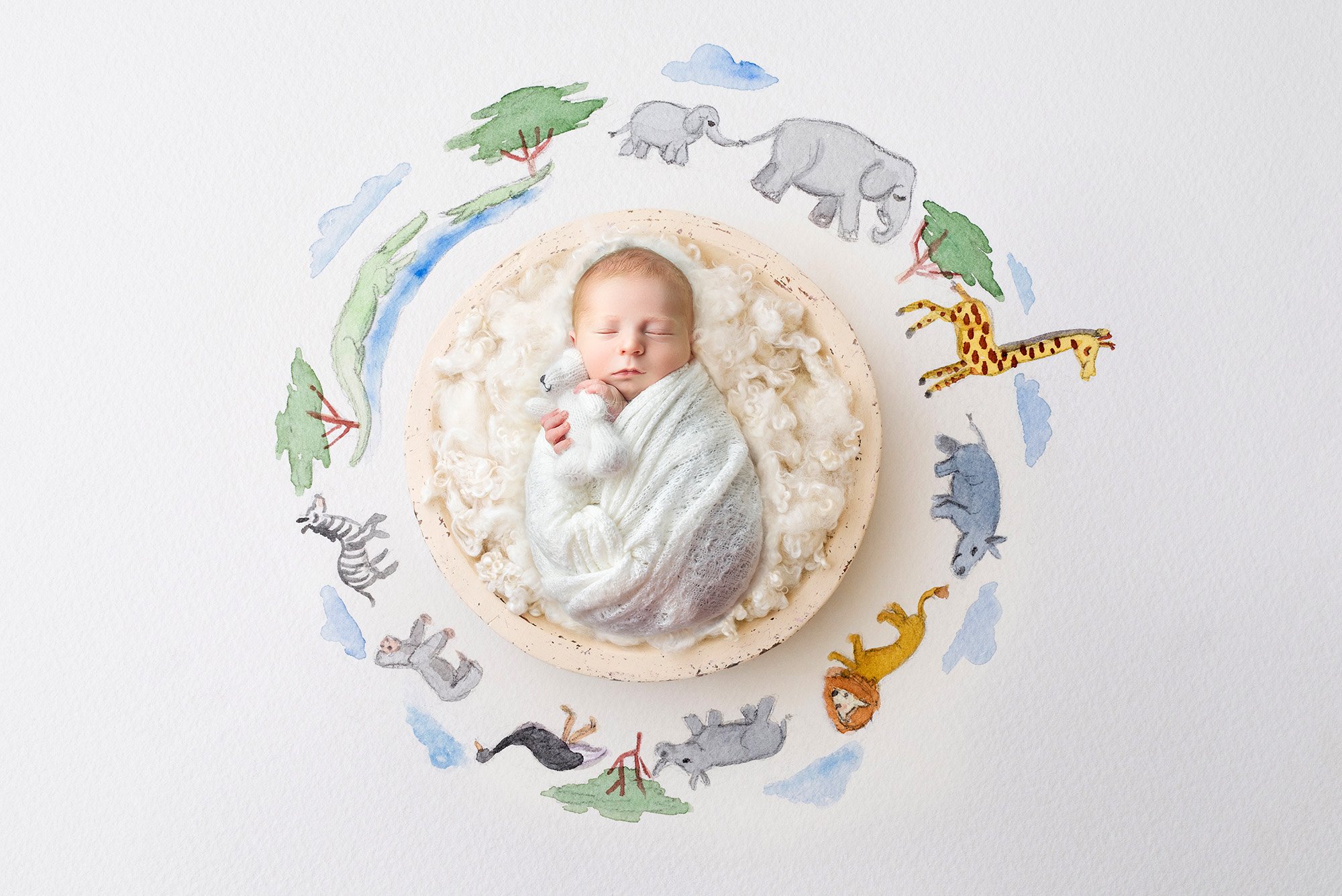 newborn baby boy holding white teddy bear sound asleep surrounded by safari animals