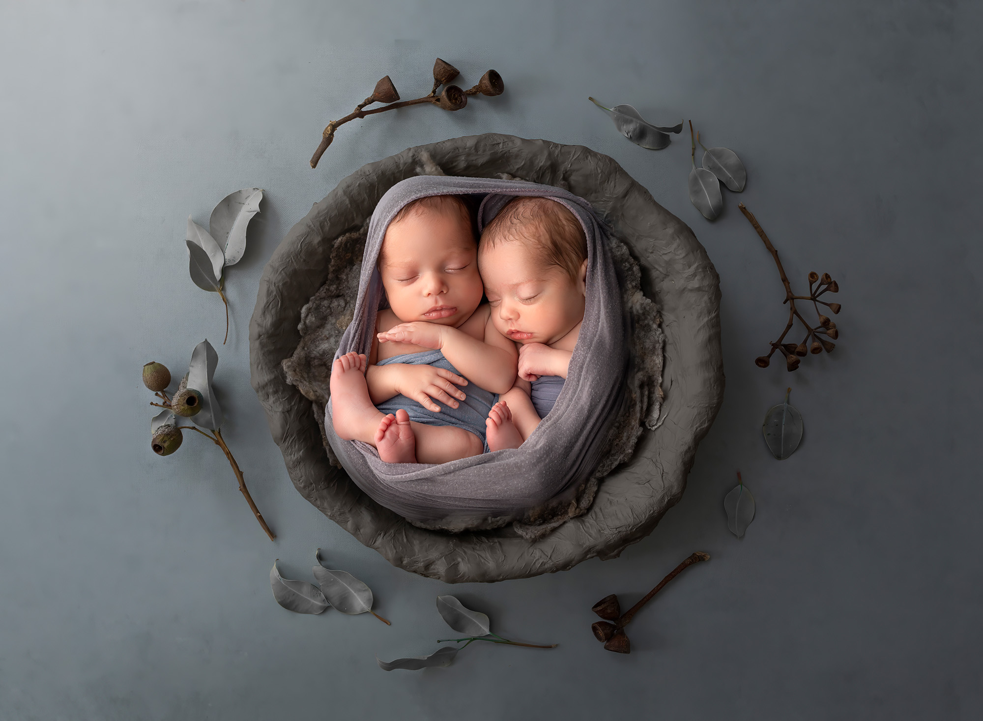 best time for newborn photos sleeping twins wrapped in grey