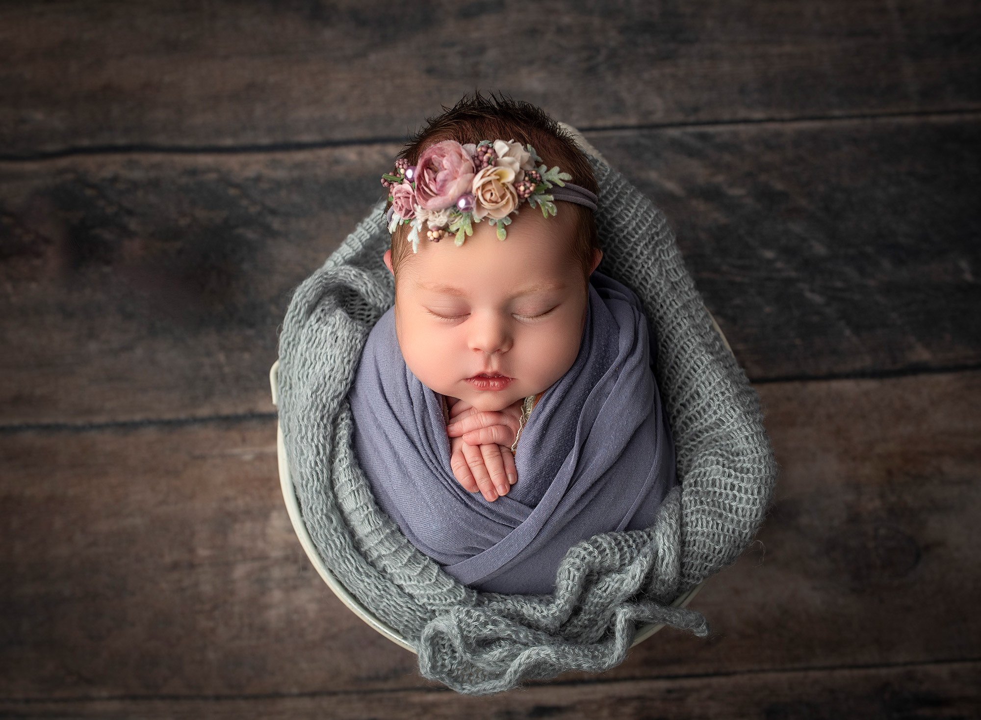 best newborn photography newborn baby sleeping in a bucket