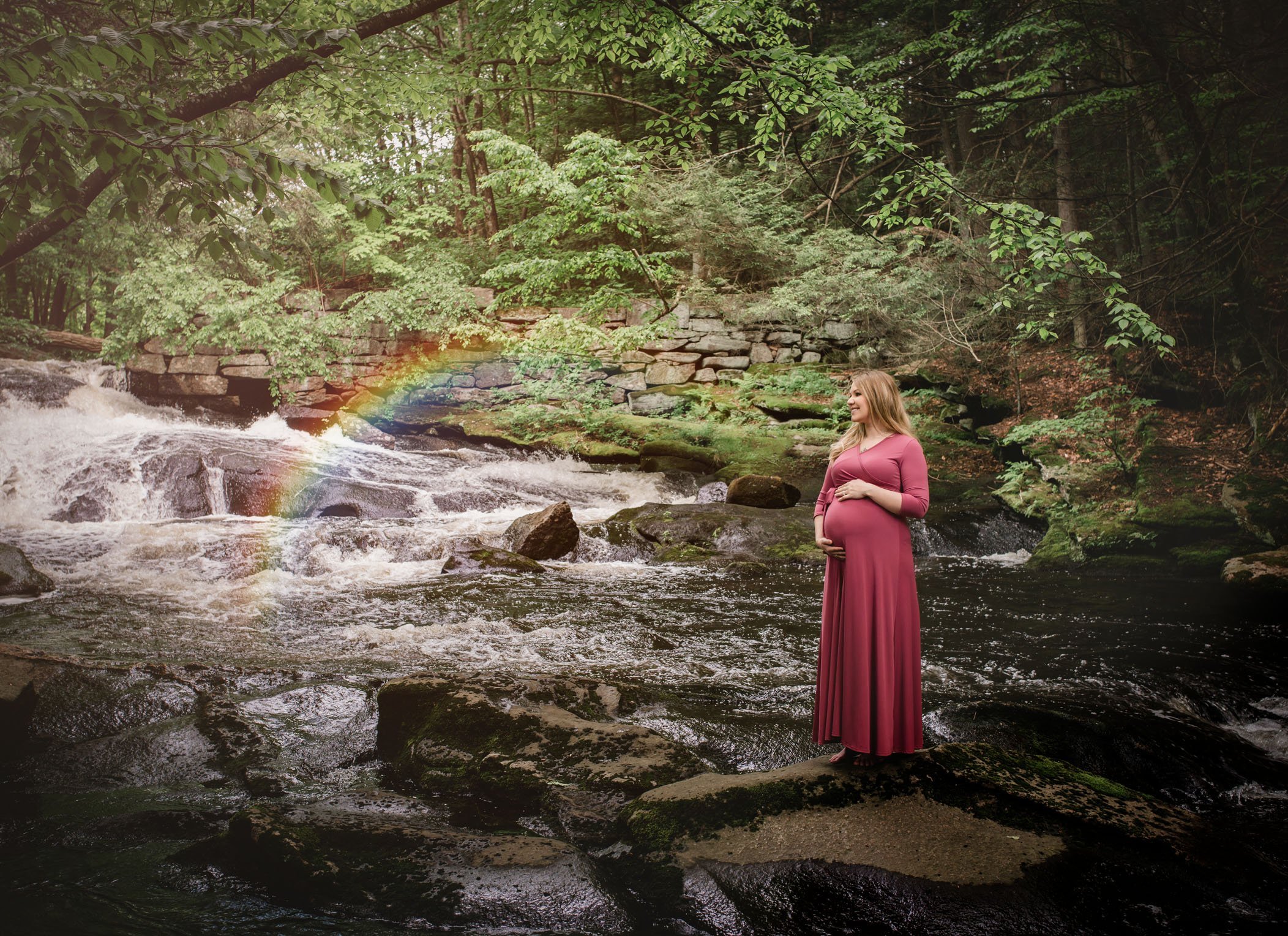 Maternity with Mom standing in rapids with rainbow