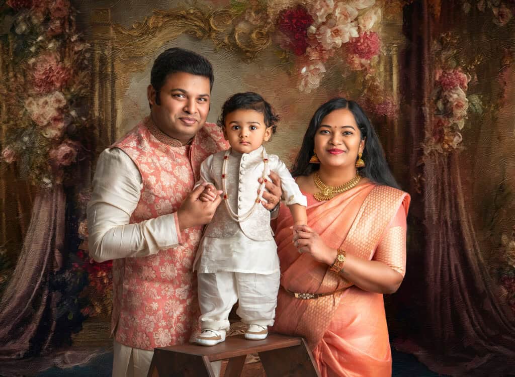 family professional pictures Indian family dressed in traditional indian costume with their 1 year old son on a studio background