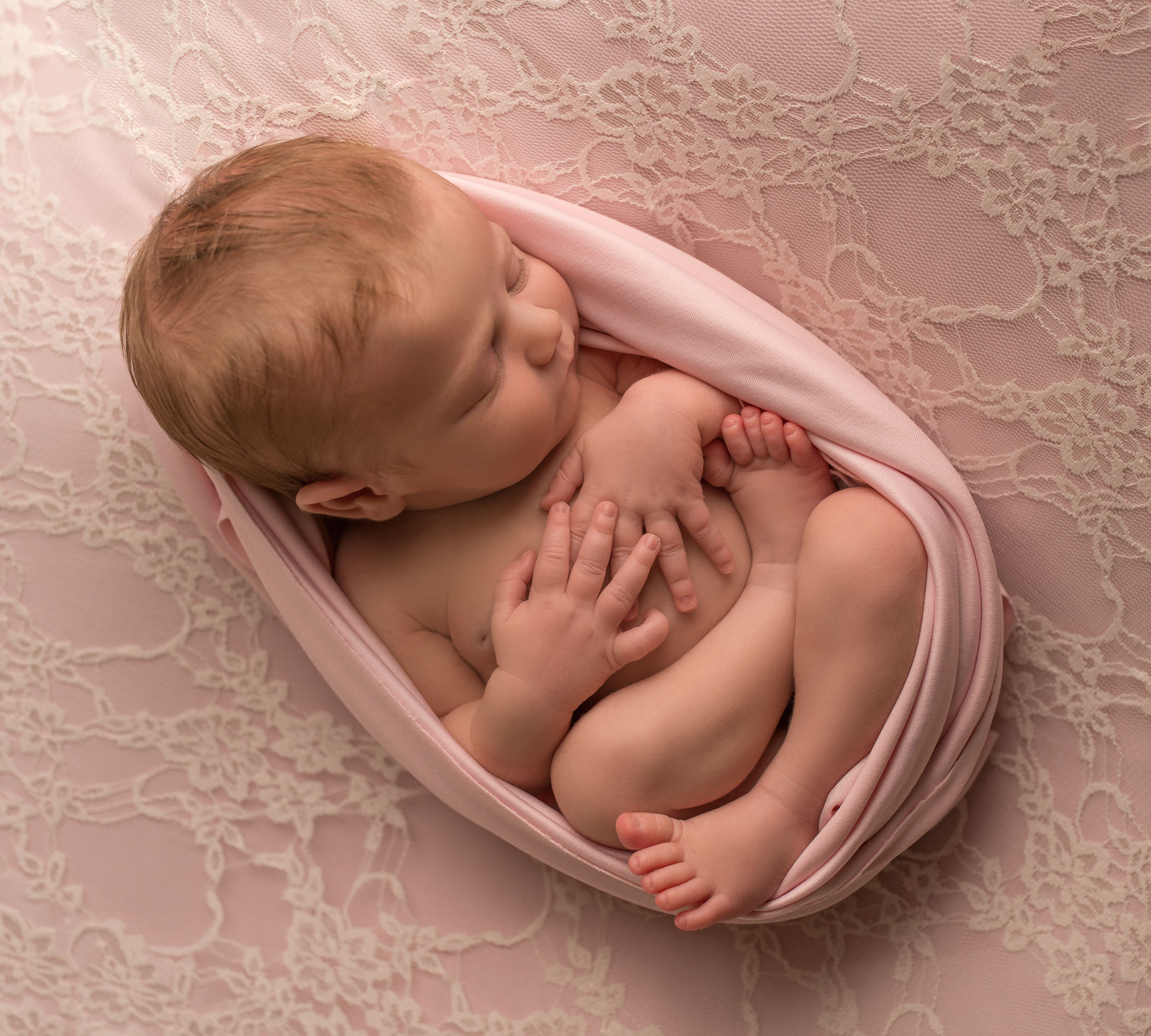 newborn baby in lotus position