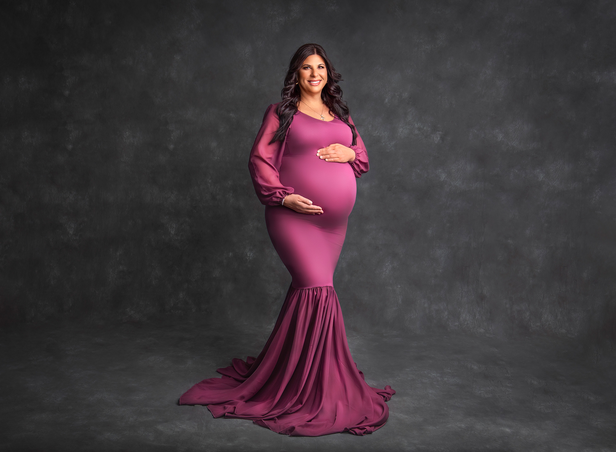 Newborn Maternity Photographer pregnant mom dressed in raspberry floor length gown